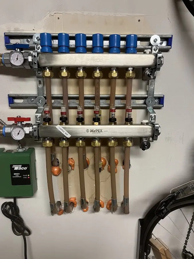 Plumber performing Water Heater Repair at a residential property in Algona